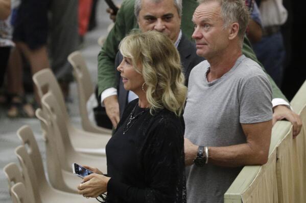 FILE - In this photo taken on Aug. 8, 2018, British musician Gordon Sumner, better known as Sting, right, and his wife Trudie Styler, attend the weekly general audience of Pope Francis at the Vatican. The family of a late duke who sold Sting his Tuscan winery says the singer’s apology for comments the family deems slanderous falls flat. The dispute exploded in Italian newspapers when Sting told Corriere della Sera’s weekly magazine Sette on Aug. 13 that he was persuaded to buy the estate near Florence in 1997 after tasting an “excellent” glass of red wine offered by the owner, Simone Vincenzo Velluti Zati di San Clemente, only to learn later that it was a Barolo from the Piedmont region and not a Tuscan Chianti at all. (AP Photo/Gregorio Borgia)