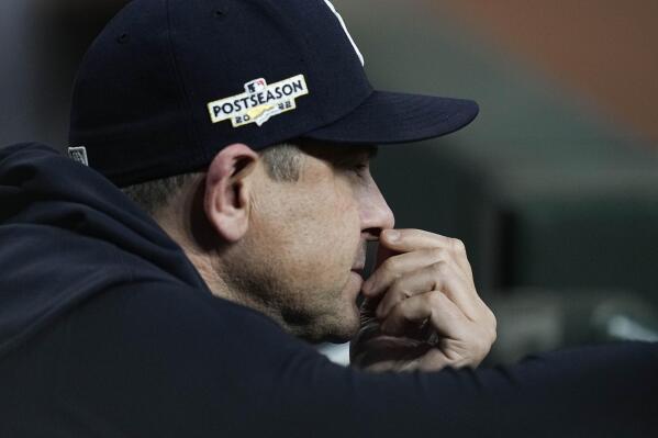 New York Yankees manager Aaron Boone watches play from the dugout during the ninth inning in Game 2 of baseball's American League Championship Series between the Houston Astros and the New York Yankees, Thursday, Oct. 20, 2022, in Houston. (AP Photo/Kevin M. Cox)