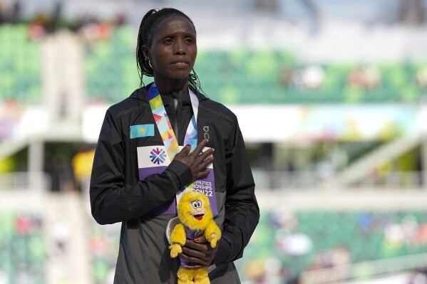 FILE - Gold medalist Norah Jeruto, of Kazakhstan, poses during a medal ceremony for the women's 3000-meter steeplechase at the World Athletics Championships on July 21, 2022, in Eugene, Ore. Former world champion steeplechase runner Norah Jeruto faces a doping case hearing in June five weeks before the Paris Olympics open. (AP Photo/Gregory Bull, File)