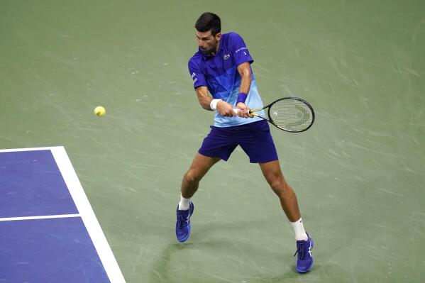 Novak Djokovic, of Serbia, prepares to hit a backhand to Matteo Berrettini, of Italy, during the quarterfinals of the U.S. Open tennis tournament Wednesday, Sept. 8, 2021, in New York. (AP Photo/Frank Franklin II)