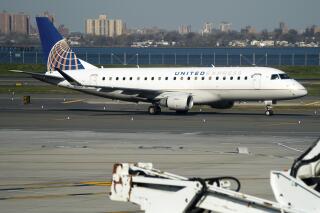 A United Airlines plane at LaGuardia Airport's Terminal B, Tuesday, Nov. 22, 2022, in New York. Travel experts say the ability of many people to work remotely is letting them take off early for Thanksgiving or return home later. Crowds are expected to rival those of 2019, the last Thanksgiving before the pandemic. (AP Photo/Julia Nikhinson)