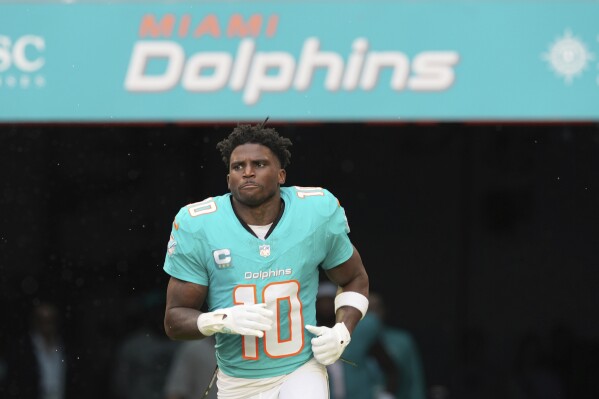 Miami Dolphins wide receiver Tyreek Hill (10) enters the field before an NFL football game against the San Francisco 49ers, Sunday, Dec. 22, 2024, in Miami Gardens, Fla. (AP Photo/Rebecca Blackwell, File)