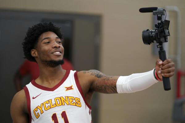 Iowa State guard Tyrese Hunter shoots a video of himself during Iowa State's NCAA college basketball media day, Wednesday, Oct. 13, 2021, in Ames, Iowa. (AP Photo/Charlie Neibergall)