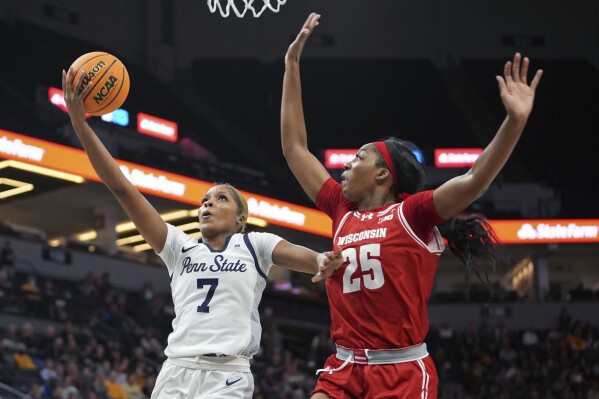 Penn State forward Grace Hall (7) shoots against Wisconsin forward Serah Williams (25) during the second half of an NCAA college basketball game at the Big Ten women's tournament Thursday, March 7, 2024, in Minneapolis. (AP Photo/Abbie Parr)