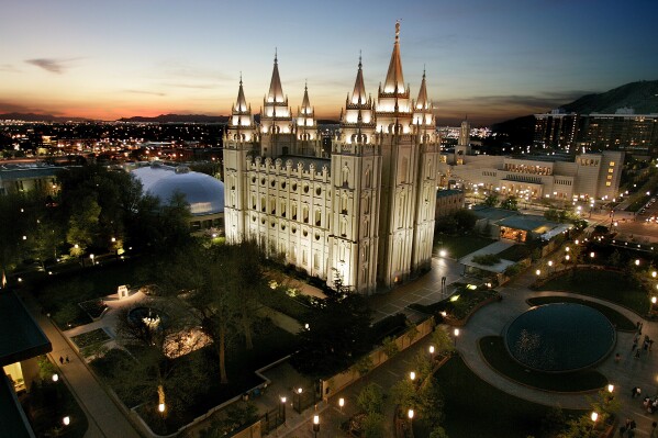 FILE - In this April 27, 2006 file photo, the sun sets behind the Mormon Temple, the centerpiece of Temple Square in Salt Lake City. A federal lawsuit filed Tuesday, Oct. 31, 2023 against The Church of Jesus Christ of Latter-Day Saints and its investment arm alleges the faith misused hundreds of thousands of dollars donated by three men by investing the money instead of using it for charitable purposes as they claim was promised. (AP Photo/Douglas C. Pizac, File)