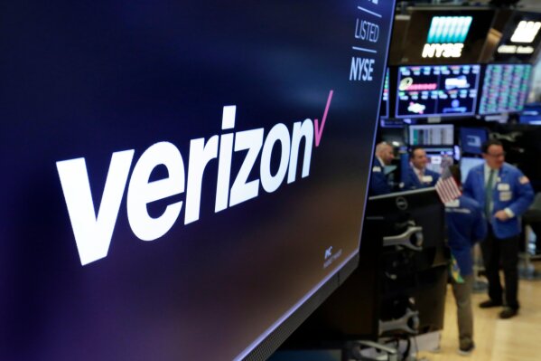 
              FILE- This April 23, 2018, file photo shows the logo for Verizon above a trading post on the floor of the New York Stock Exchange. Cellular companies such as Verizon are looking to challenge traditional cable companies with residential internet service that promises to be ultra-fast, affordable and wireless. Using an emerging wireless technology known as 5G, Verizon’s 5G Home service provides an alternative to cable for connecting laptops, phones, TVs and other devices over Wi-Fi. It launches in four U.S. cities on Monday, Oct. 1. (AP Photo/Richard Drew, File)
            