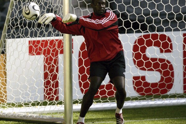 FILE - Goalkeeper Shaka Hislop, of Trinidad and Tobago, flicks the ball during the official training session at FIFA World Cup Stadium in Dortmund, Germany, June 9, 2006. Soccer analyst and former Premier League goaltender Hislop said Monday, July 24, 2023, he is seeking “the best medical opinion,” he can get, one day after collapsing on the set of ESPN’s pregame show ahead of the friendly between Real Madrid and AC Milan at the Rose Bowl. Neither Hislop not ESPN has given a cause for the collapse. (AP Photo/Eugene Hoshiko, File)