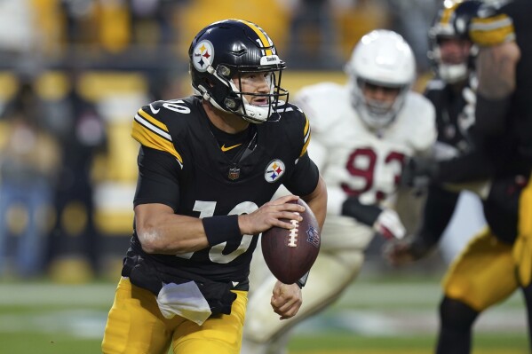 Pittsburgh Steelers quarterback Mitch Trubisky scrambles with the ball against the Arizona Cardinals during the second half of an NFL football game Sunday, Dec. 3, 2023, in Pittsburgh. The Cardinals won 24-10. (AP Photo/Matt Freed)