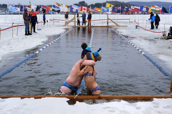 Totally cold' is not too cold for winter swimmers competing in a frozen  Vermont lake