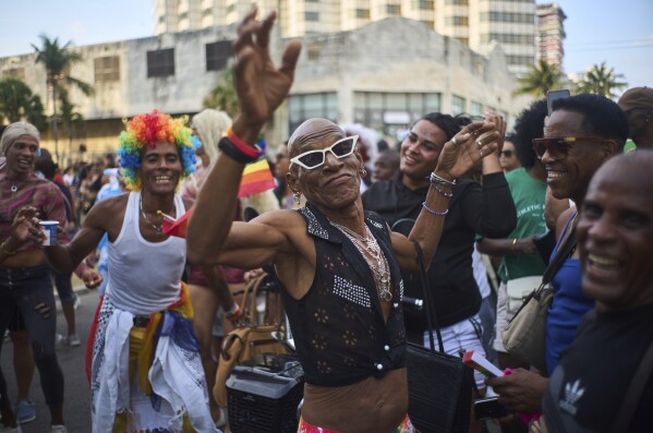 A member of the LGBTQ+ community dances during a Gay Pride march in support of the fight for tolerance and acceptance, in Havana, Cuba, Saturday, May 10, 2025. (AP Photo/Ramon Espinosa)