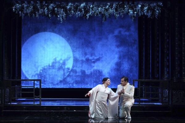 This image released by LA Opera shows Karah Son as Cio-Cio-San, left, and Jonathan Tetelma as Pinkerton during a performance of Mario Gras's 