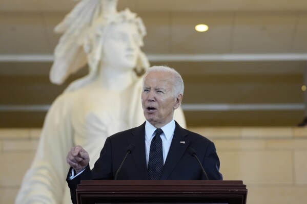 President Joe Biden speaks at the U.S. Holocaust Memorial Museum's Annual Days of Remembrance ceremony at the U.S. Capitol, Tuesday, May 7, 2024 in Washington. Statue of Freedom stands behind.(AP Photo/Evan Vucci)