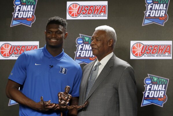 
              Duke freshman Zion Williamson and National Collegiate Basketball Hall of Fame member Oscar Robertson pose with the Oscar Robertson Trophy at a news conference where Williamson was awarded the U.S. Basketball Writers Association College Player of the Year award at the Final Four NCAA college basketball tournament, Friday, April 5, 2019, in Minneapolis. (AP Photo/Charlie Neibergall)
            