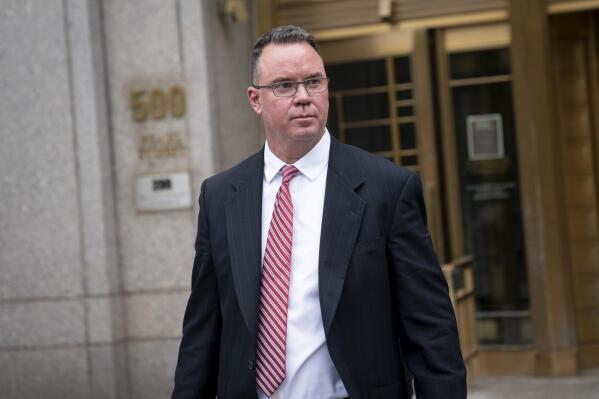 FILE - Timothy Shea exits Manhattan federal court after his court case was declared a mistrial on June 7, 2022, in New York. A lawyer for Shea, accused of cheating donors to a $25 million fund to build a wall along the southern U.S. border, told jurors on Tuesday, Oct. 25, 2022, that they should question why his client's fraud trial is being held in New York, tapping into a theme that may have contributed to an earlier trial ending with a deadlocked jury. (AP Photo/John Minchillo, File)