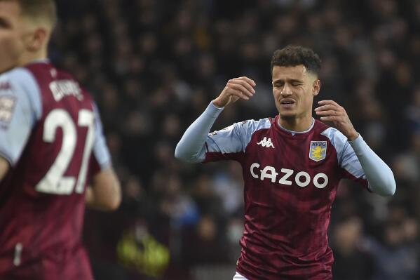 Aston Villa's Philippe Coutinho, right, reacts during the English Premier League soccer match between Aston Villa and Leeds United at Villa Park in Birmingham, England, Wednesday, Feb. 9, 2022. (AP Photo/Rui Vieira)