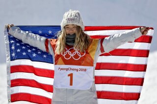 
              Chloe Kim, of the United States, celebrates winning gold in the women's halfpipe finals at Phoenix Snow Park at the 2018 Winter Olympics in Pyeongchang, South Korea, Tuesday, Feb. 13, 2018. (AP Photo/Gregory Bull)
            
