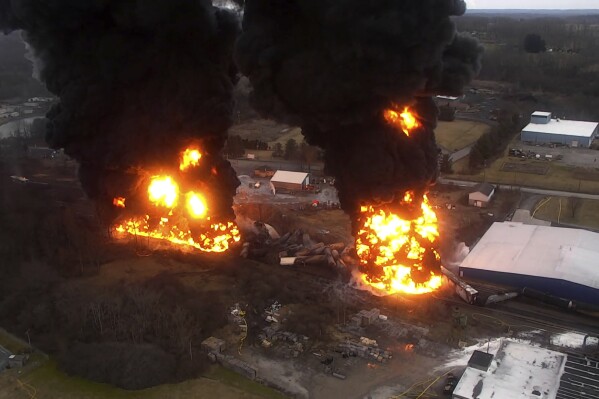 A frame grab from drone video taken by the Columbiana County Commissioner’s Office and released by the NTSB shows towering flames and columns of smoke resulting from a 