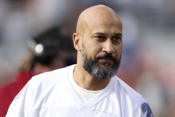 Actor Keegan-Michael Key watches players warm up before the NFC Championship NFL football game between the San Francisco 49ers and the Detroit Lions in Santa Clara, Calif., Sunday, Jan. 28, 2024. (AP Photo/Jed Jacobsohn)