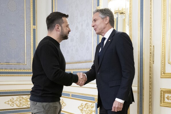 Ukraine's President Volodymyr Zelenskyy, left, greets U.S. Secretary of State Antony Blinken, right, prior to their meeting in Kyiv, Ukraine, Tuesday, May 14, 2024. Blinken arrived in Kyiv on Tuesday in an unannounced diplomatic mission to reassure Ukraine that it has American support as it struggles to defend against increasingly intense Russian attacks. (Brendan Smialowski/Pool Photo via AP)