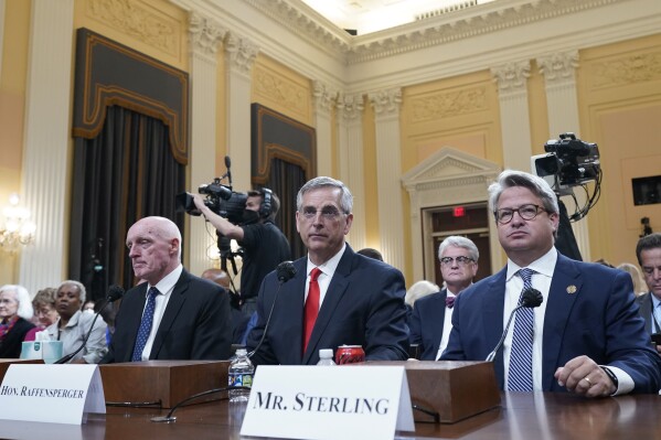 FILE - Rusty Bowers, Arizona state House Speaker, from left, Brad Raffensperger, Georgia Secretary of State, and Gabe Sterling, COO for the Georgia Secretary of State’s Office, attend a hearing investigating the Jan. 6 attack on the U.S. Capitol at the Capitol in Washington, June 21, 2022. With six months to go before the presidential election, concerns are running high among election officials that public distrust of voting and ballot counting persists. Sterling is part of an effort that seeks to bring together Republican officials who are willing to defend the country's election systems. (AP Photo/Jacquelyn Martin, File)