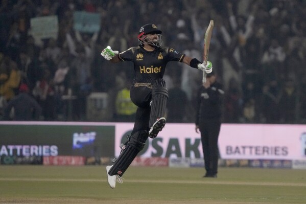 Peshawar Zalmi' Babar Azam celebrates after scoring century during the Pakistan Super League T20 cricket match between Peshawar Zalmi and Islamabad United, in Lahore, Pakistan, Monday, Feb. 26, 2024. (AP Photo/K.M. Chaudary)