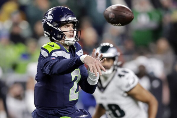 FILE - Seattle Seahawks quarterback Drew Lock throws a pass in the first half of an NFL football game,against the Philadelphia Eagles Monday, Dec. 18, 2023, in Seattle. Lock signed a one-year $5 million contract this week as a free agent with the New York Giants. (AP Photo/ John Froschauer, File)