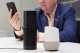 A man holds an iPhone next to an Amazon Echo, center, and a Google Home, right, in New York on June 14, 2018. A study published Monday, Aug. 28, 2023, in JAMA Network Open, says Alexa, Siri and other voice assistants could do a better job giving instructions on CPR to help bystanders respond in emergencies. (AP Photo/Mark Lennihan)