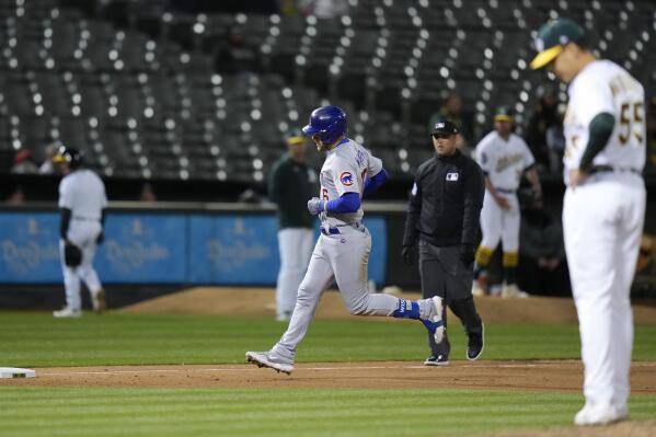 Patrick Wisdom of the Chicago Cubs runs the bases after hitting a two