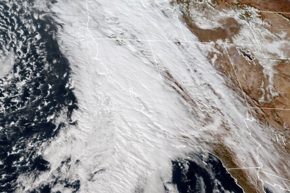 This GOES-West GeoColor composite satellite image taken at 5:30 p.m. EST, Wednesday, Jan. 31 2024, and provided by The National Oceanic and Atmospheric Administration (NOAA), shows a storm moving over California and the Western U.S. (NOAA via AP)