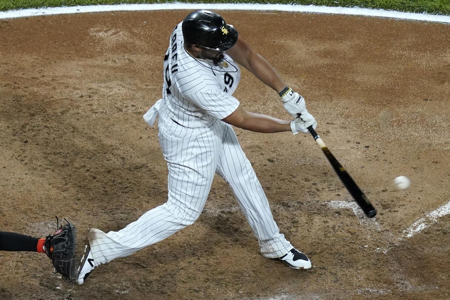 Baltimore Orioles starting pitcher Adam Eaton throws to a Chicago