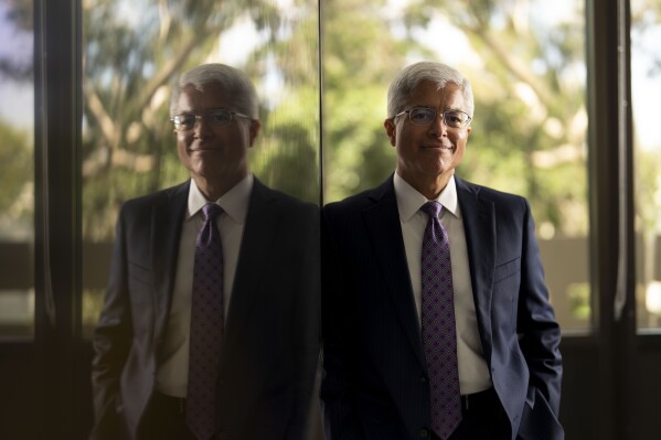 Pedro Pizarro, president and CEO of Edison International, a holding company that includes a major California utility, stands for a photo in Rosemead, Calif., Wednesday, Oct. 11, 2023. Pizarro says his firm doesn’t burn fossil fuels and he doesn’t consider it a fossil fuel company even though they get at least 40% of the electricity they supply from burning natural gas. (AP Photo/Jae C. Hong)