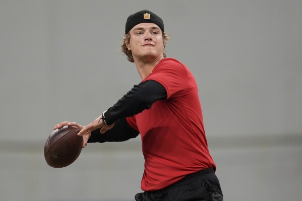 Minnesota Vikings quarterback J.J. McCarthy (9) takes part in drills during an NFL football team practice in Eagan, Minn., Tuesday, April 29, 2025. (AP Photo/Abbie Parr)