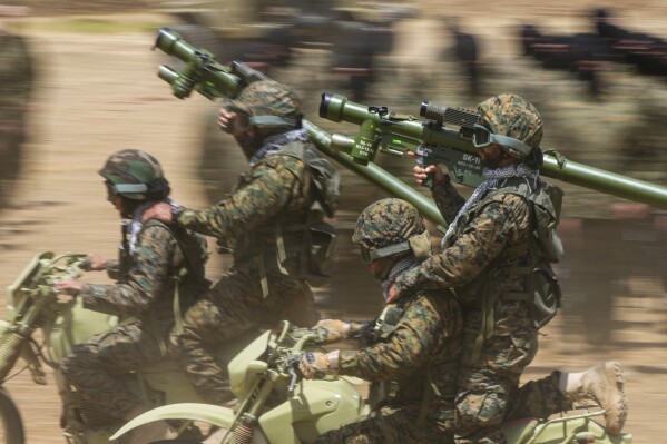 Fighters from the Lebanese militant group Hezbollah train in southern Lebanon, May 21, 2023. (AP Photo/Hassan Ammar, File)