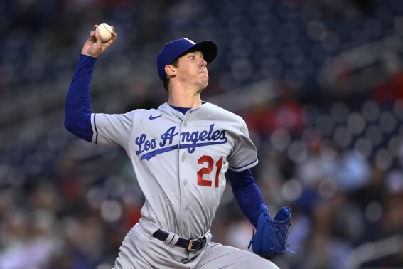 FILE - Los Angeles Dodgers starting pitcher Walker Buehler throws to a Washington Nationals batter during a baseball game May 24, 2022, in Washington. Buehler said Wednesday, Sept. 13, 2023, he shut down his comeback from Tommy John surgery this season because he wasn't recovering well after a rehab start. The right-hander tossed two scoreless innings in a rehab appearance on Sept. 3 for Triple-A Oklahoma City. (AP Photo/Nick Wass, File)