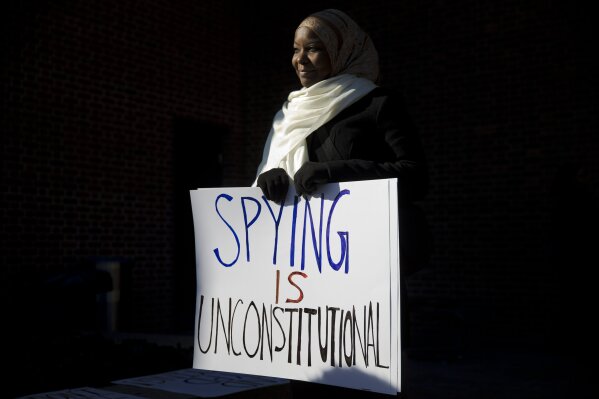 FILE - In this Jan. 13, 2015 file photo, Kameelah Rashad, president of Muslim Wellness Foundation, demonstrates outside the U.S. Courthouse in Philadelphia. In the wake of George Floyd's death in police custody, dozens of American Muslim organizations have come together to call for reform to policing practices, and to support black-led organizations.  “I’m hopeful and heartened by the number and diversity of groups that have signed on,” said Rashad.  “That says to me that there’s at least recognition that we as a whole can no longer separate Islamophobia, anti-Black racism, surveillance, and violence." (AP Photo/Matt Rourke, File)