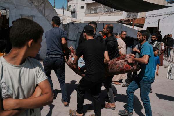 A Palestinian, who was injured in an Israeli airstrike, is brought for treatment at the Baptist Hospital in Gaza City, Friday, May 30, 2025. (AP Photo/Jehad Alshrafi)