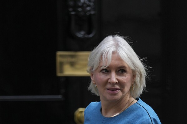 FILE - Britain's Secretary of State for Digital, Culture, Media Nadine Dorries leaves 10 Downing Street following a cabinet meeting where the cabinet were given details of the Spring Statement by the Rishi Sunak Chancellor of the Exchequer in London, on March 23, 2022. British Conservative lawmaker Nadine Dorries finally stepped down from Parliament on Saturday Aug. 26, 2023, more than two months after announcing she was quitting in the wake of former Prime Minister Boris Johnson’s resignation from Parliament. (AP Photo/Alastair Grant, File)