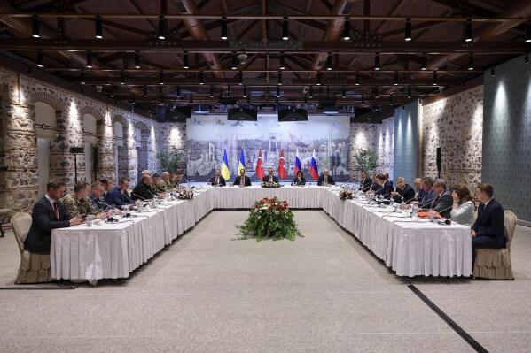 In this handout photo released by Turkish Foreign Ministry, Turkish Foreign Minister Hakan Fidan, center, chairs a meeting between delegations from Russia, right, and Ukraine, left, at Dolmabahce palace in Istanbul, Turkey, Friday, May 16, 2025. (Murat Gok/Turkish Foreign Ministry via AP)