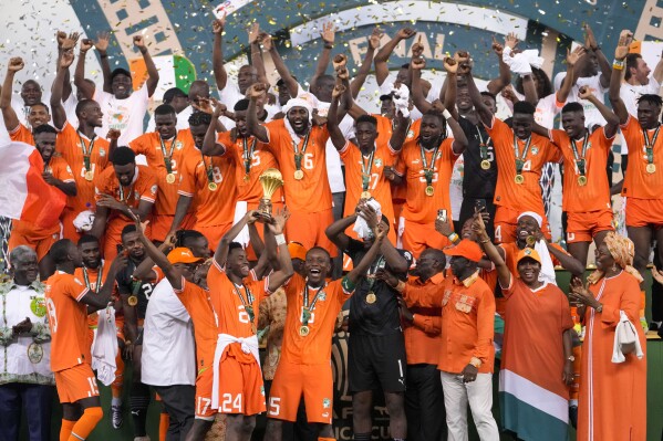 Ivory Coast players celebrate after winning the African Cup of Nations final soccer match between Nigeria and Ivory Coast, at the Olympic Stadium of Ebimpe in Abidjan, Ivory Coast, Sunday, Feb. 11, 2024. (APPhoto/Sunday Alamba)