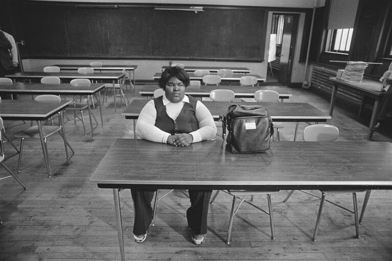 FILE - Valerie Banks was the only student to show up for her geography class at South Boston High School on the first day of court-ordered busing to desegregate Boston's schools, Sept. 12, 1974. Seventy years after the Supreme Court's Brown v. Board, America is both more diverse — and more segregated. (AP Photo, File)
