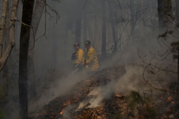 First rain and then fire chase people from their homes in North and South Carolina AP News