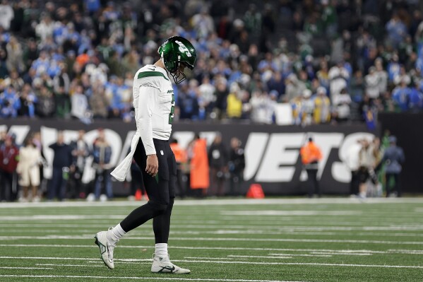 New York Jets quarterback Zach Wilson (2) walks on the field during the fourth quarter an NFL football game against the Los Angeles Chargers, Monday, Nov. 6, 2023, in East Rutherford, N.J. (AP Photo/Adam Hunger)