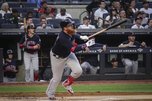 Boston Red Sox's Justin Turner watches his solo home run in the second inning of a baseball game against the New York Yankees, Sunday, June 11, 2023, in New York. (AP Photo/Bebeto Matthews)