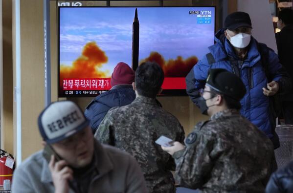 People watch a TV showing a file image of North Korea's missile launch during a news program, at the Seoul Railway Station in Seoul, South Korea, Sunday, Feb. 27, 2022. North Korea on Sunday launched a suspected ballistic missile into the sea, South Korean and Japanese officials said, in an apparent resumption of its weapons tests following the end of the Winter Olympics in China, the North's last major ally and economic pipeline. (AP Photo/Ahn Young-joon)