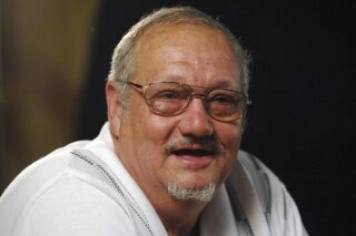 In this Aug. 30, 2007 photo Jack Whittaker speaks during an interview in Mount Hope, W.Va. Whittaker Jr., whose life became rife with setbacks and tragedy after winning a record $315 Powerball jackpot on Christmas night in 2002, has died. He was 72. On Tuesday, June 30, 2020, Ronald Meadows Funeral Parlor in Hinton, West Virginia confirmed Whittaker’s death. (AP Photo/Jeff Gentner)