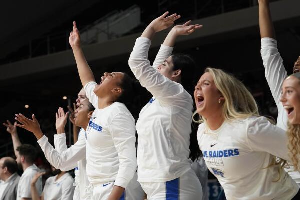 The Middle Tennessee State bench cheers during the second half of an NCAA college basketball game against Western Kentucky of the Conference USA Tournament final in Frisco, Texas, Saturday, March 11, 2023. (AP Photo/LM Otero)