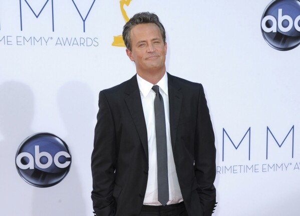 FILE - Actor Matthew Perry arrives at the 64th Primetime Emmy Awards in Los Angeles on Sept. 23, 2012. (Photo by Jordan Strauss/Invision/AP, File)