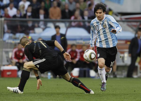 FILE - Argentina's Lionel Messi, right, Germany's Bastian Schweinsteiger, left, during the World Cup quarterfinal soccer match between Argentina and Germany at the Green Point stadium in Cape Town, South Africa, Saturday, July 3, 2010. (AP Photo/Gero Breloer, File)