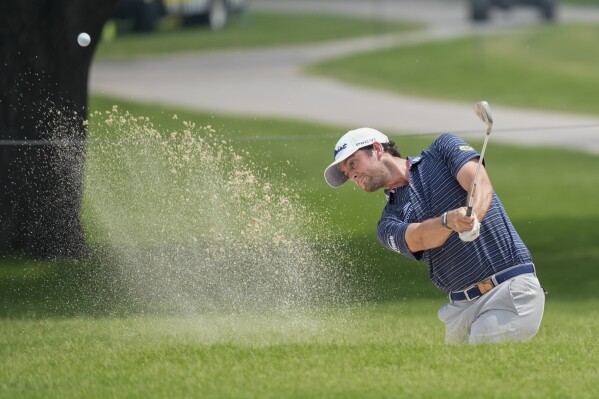 Davis Riley hits out of a trap on the second hole during the second round of the Charles Schwab Challenge golf tournament at Colonial Country Club, Friday, May 24, 2024, in Fort Worth, Texas. (AP Photo/LM Otero)