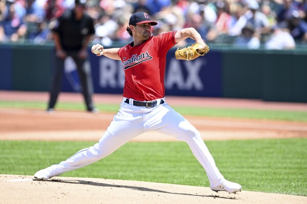 Cleveland Guardians starting pitcher Shane Bieber delivers during the first inning of a baseball game against the Kansas City Royals, Sunday, July 9, 2023, in Cleveland. (AP Photo/Nick Cammett)